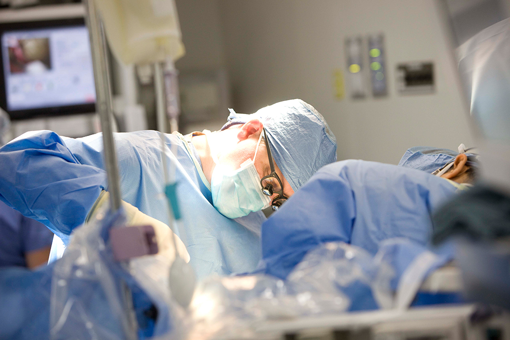 Carl Heilman, MD performing surgery