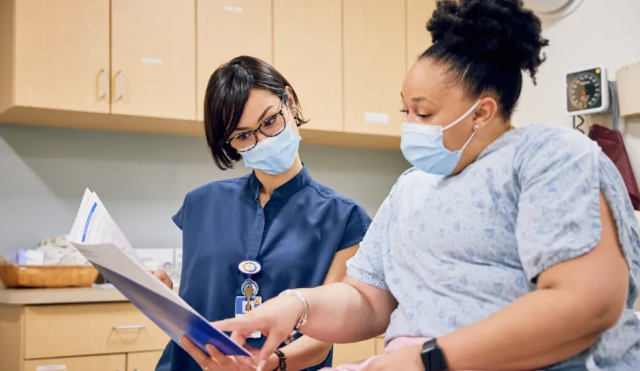 Doctor and patient reviewing paperwork