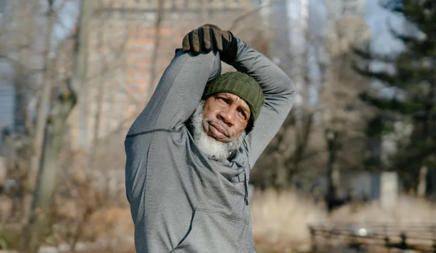 Man stretching outside