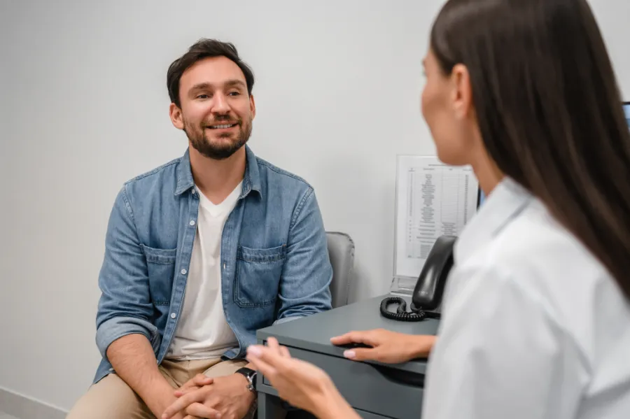 A patient speaking with a cardiologist