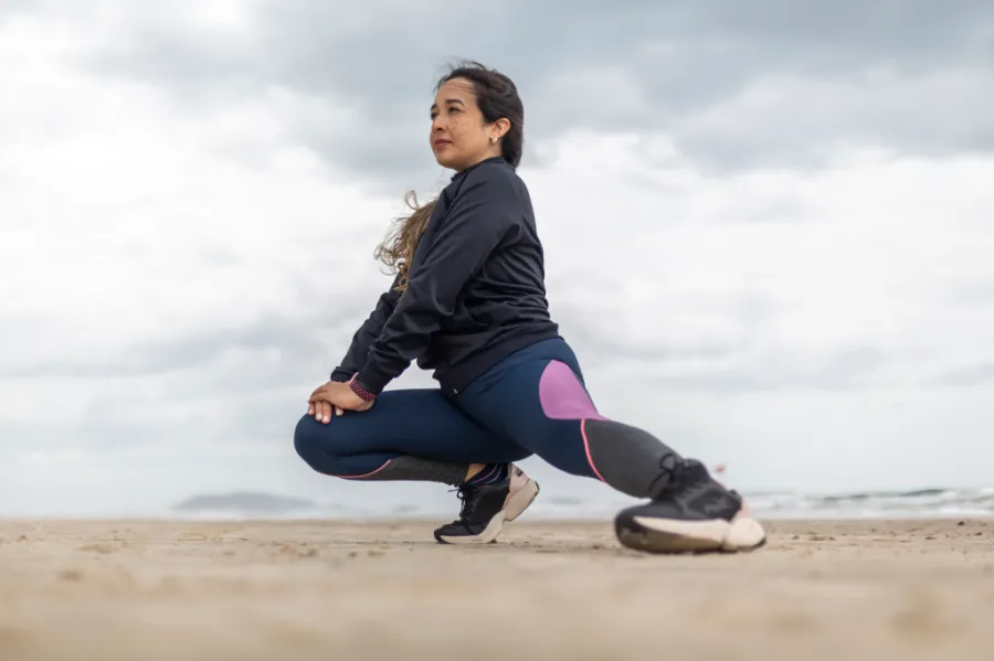Woman stretching on the beach
