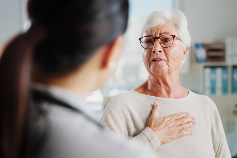 Woman describing chest discomfort