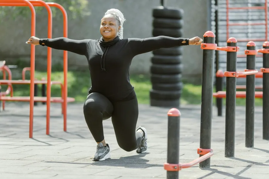 A woman working out at an outdoor gym