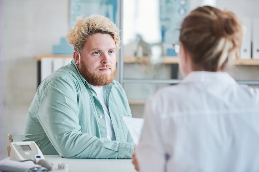A man speaking with his doctor
