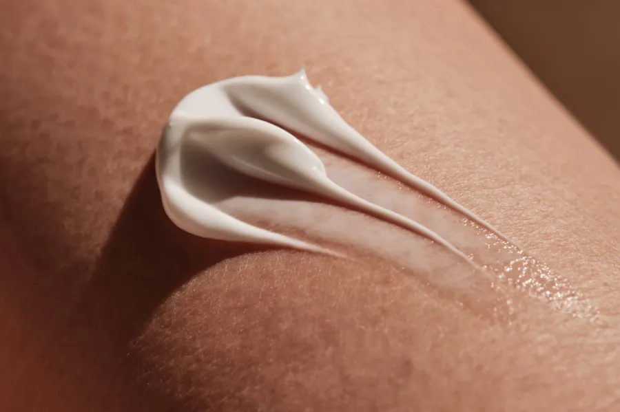 Sunscreen being applied on skin