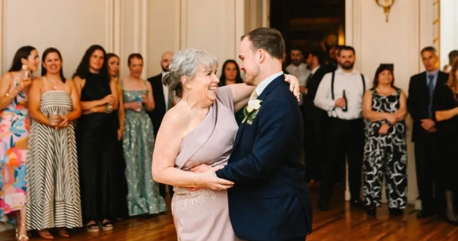 Sandy dancing with her son at his wedding