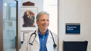 John Ragucci, MD standing in office doorway at Lowell General Hospital's Family Care office.