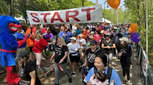Community fundraising walk with hundreds of participants.