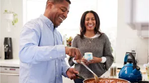 Couple cooking together.
