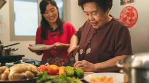 Asian family cooking together