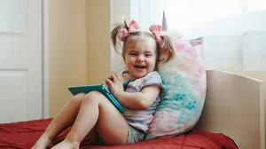 Child playing tablet at home