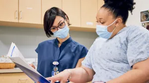 Doctor and patient reviewing paperwork
