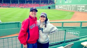 Father and daughter posing at Fenway Park