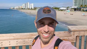 Bryan Licciardi on a pier at the beach