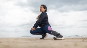 Woman stretching on the beach