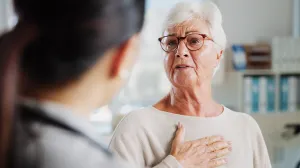 Woman describing chest discomfort