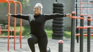 A woman working out at an outdoor gym