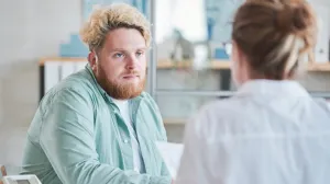 A man speaking with his doctor