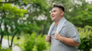 Young adult smiling after exercise in an outdoor setting