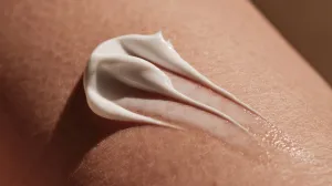 Sunscreen being applied on skin