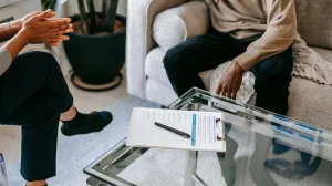 Therapist talking to patient