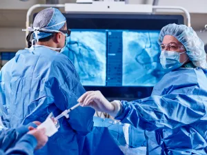 Doctor and nurse working together during a surgery in Lowell General Hospital's Heart and Vascular Cath Lab.