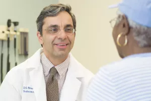 Anastassios Pittas, MD, MS, endocrinologist and Co-Director of the Diabetes Center at Tufts Medical Center consults with patient in clinic appointment. 