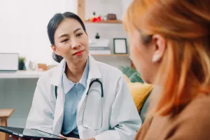 Female psychiatrists talking with a patient