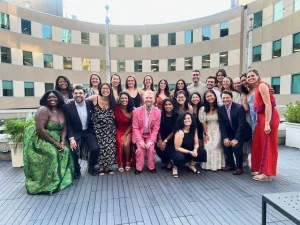 A large group of people smiling