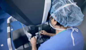 Doctor at robotic surgery device
