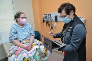 Dr taking notes with patient