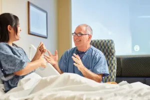 Doctor talking to patient in room