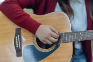 Person playing a guitar
